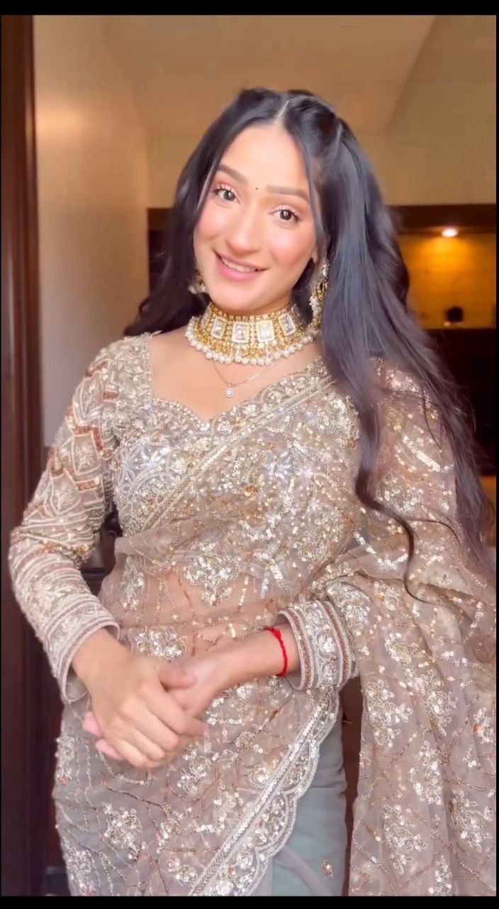 Flattering Heavy Sequins Work White Color Net Saree