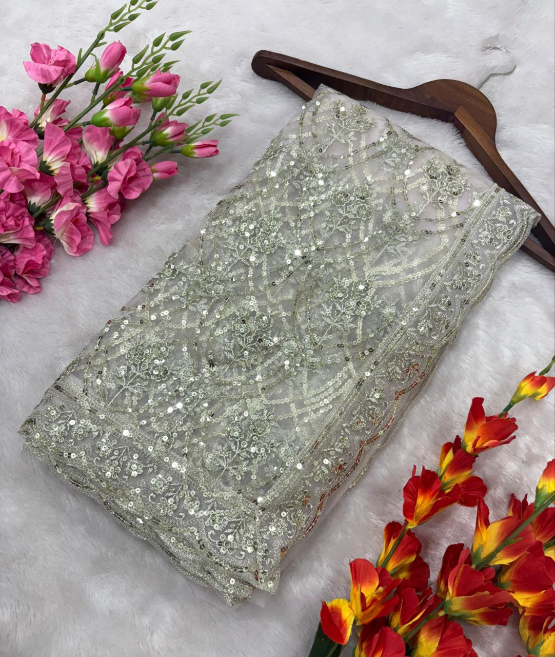 Flattering Heavy Sequins Work White Color Net Saree