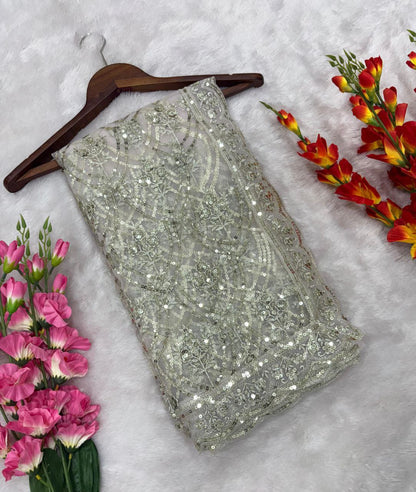 Flattering Heavy Sequins Work White Color Net Saree