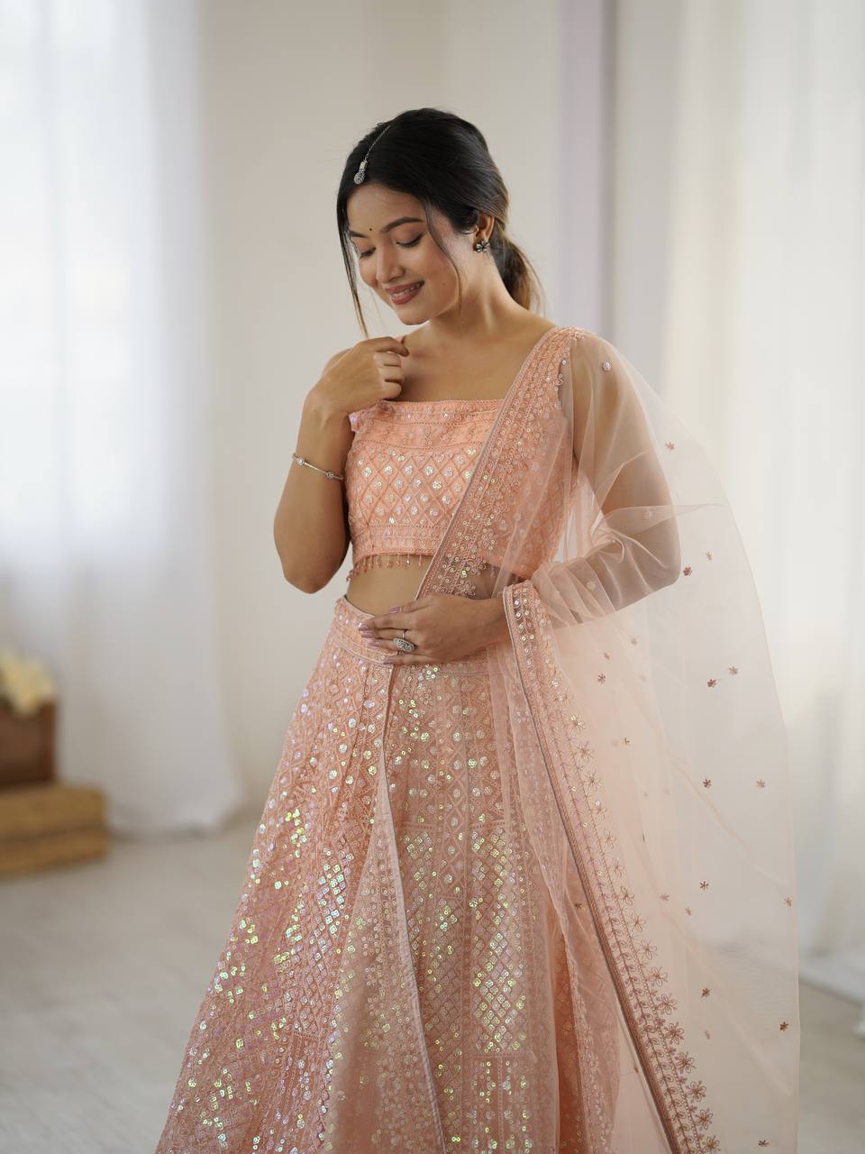 Marvelous Peach Net Rainbow Work Lehenga Choli