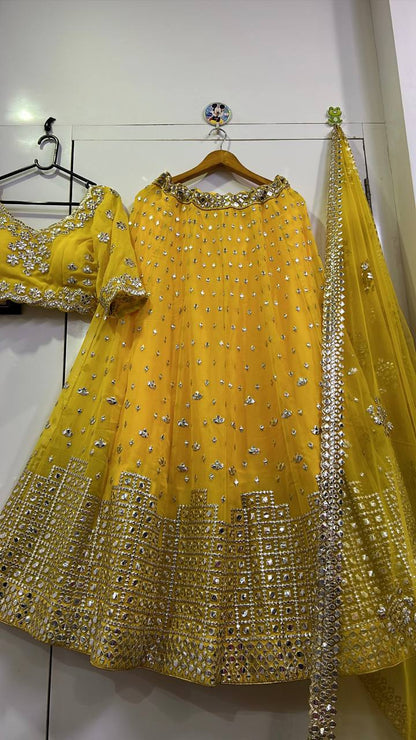 Graceful Yellow Georgette Mirror Work Lehenga Choli